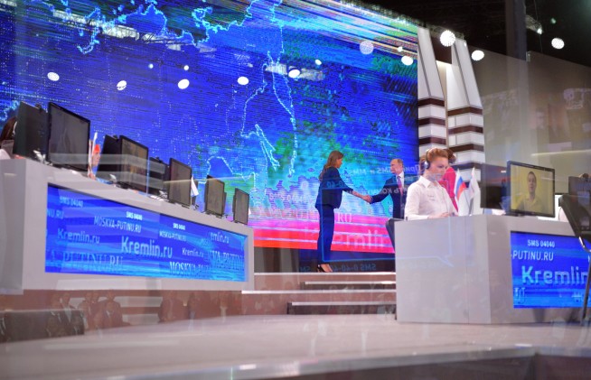 The Latest: Putin keeps mum on whether seeking another term