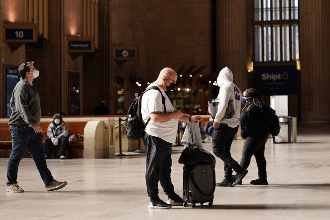 Millions stick to Thanksgiving travel plans despite warnings