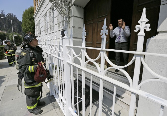 The Latest: Officials: Russian consulate fire in fireplace