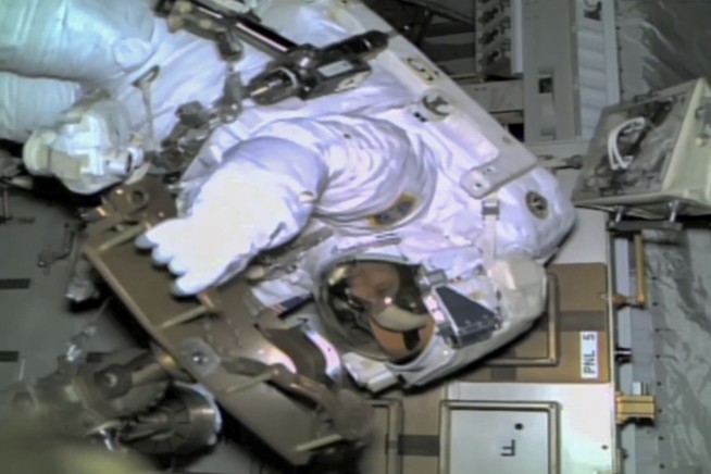 NASA's stuck astronaut steps out on a spacewalk after 7 months in orbit