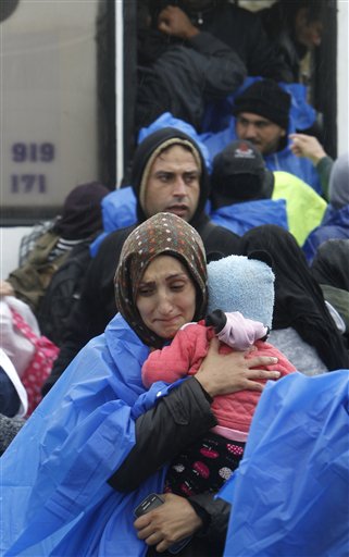 The Latest: Hungary's Orban: Stop migrants from coming in