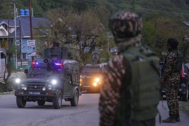 Militants kill at least 26 tourists at a resort in Indian-controlled Kashmir