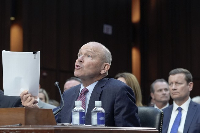 Boeing CEO defends his safety record, spars with senators and apologizes to crash victims' relatives