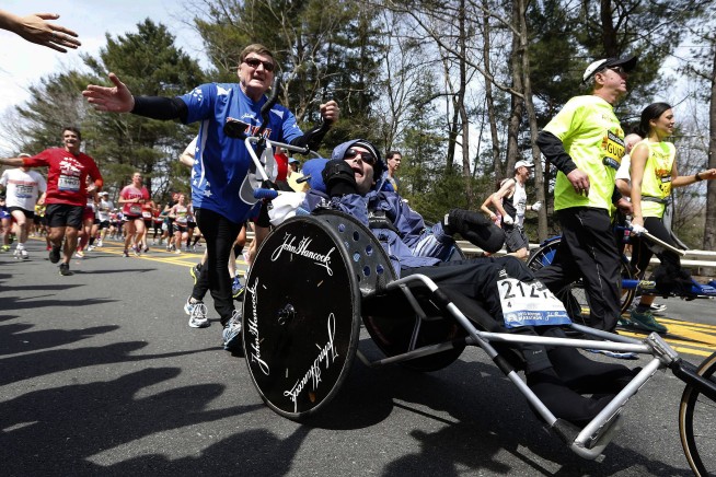 Rick Hoyt, who became a Boston Marathon fixture with father pushing wheelchair, has died at 61