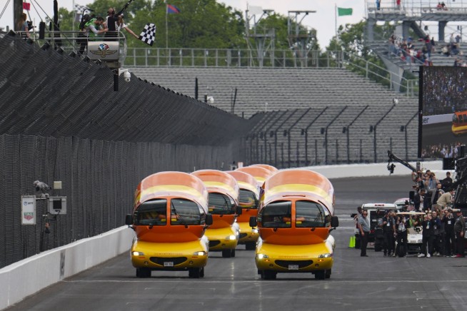 Hot diggity dog! Wienermobiles put on riveting race in Wienie 500 at Indianapolis Motor Speedway