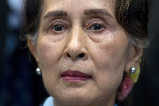 Myanmar puts Suu Kyi on trial on charges critics call bogus