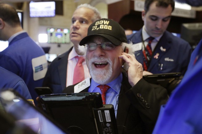 US stocks surge in early trading; Dow crosses 21,000 points