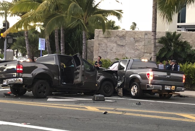 The Latest: Names released of 2 killed in Honolulu crash