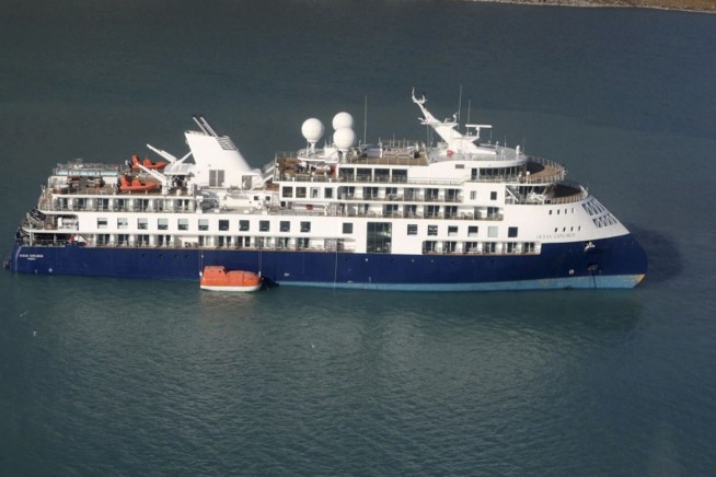 Stranded luxury cruise ship MV Ocean Explorer is pulled free at high tide in Greenland