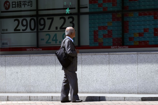 Stock market today: Asian shares mixed in choppy trading after US inflation report