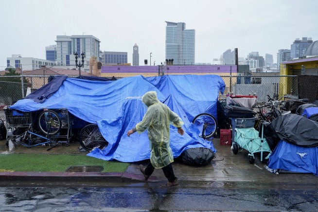 Rain from Tropical Storm Hilary lashes California and Mexico, swamping roads and trapping cars