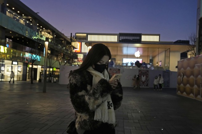 China to resume issuing passports, visas as virus curbs ease