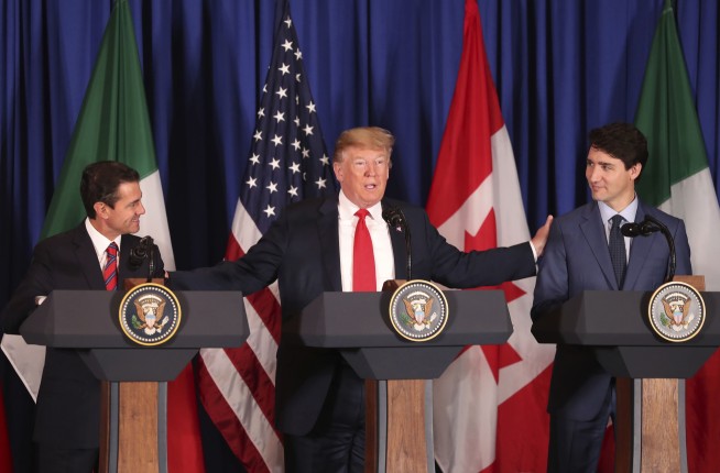 The Latest: Leaders of US, Mexico, Canada sign trade pact