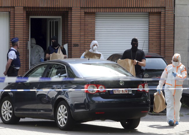 The Latest: Police raid home of Brussels attack suspect