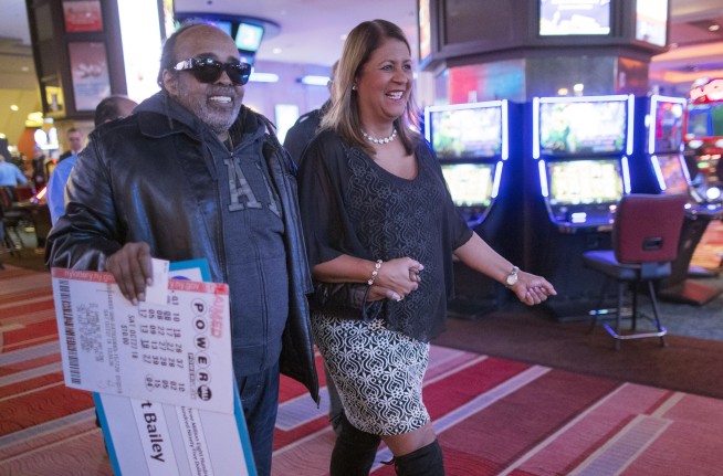 Retired government worker revealed as $343M Powerball winner