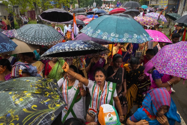 AP PHOTOS: Colorful roadshows and rallies mark India's election season before voting starts Friday