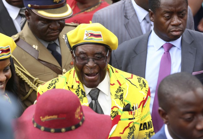 Zimbabwe army controls broadcaster, says Mugabe, wife safe