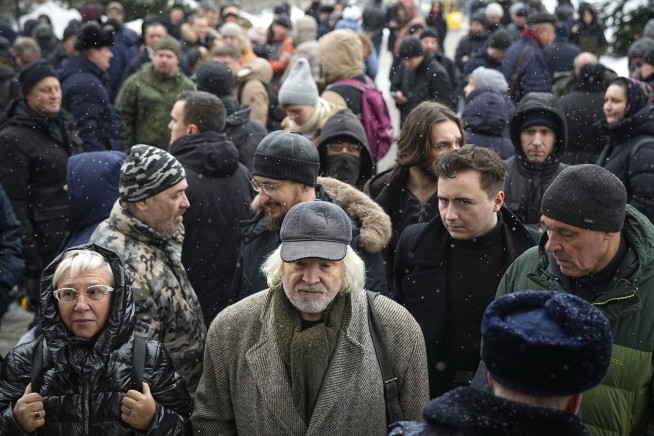 Russian courts jail a Putin critic and a woman convicted of a blast that killed a pro-war blogger