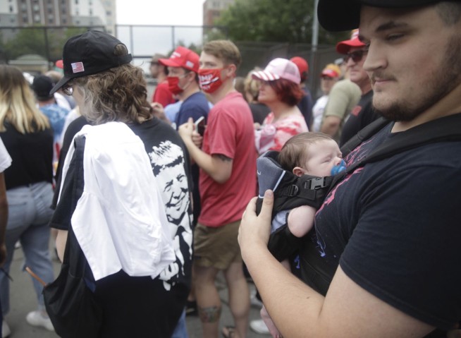 Metal barriers, Trump gear: Crowd readies for Tulsa rally