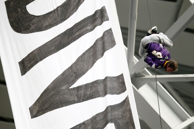 Oil pipeline protesters unfurl huge banner at Vikings game