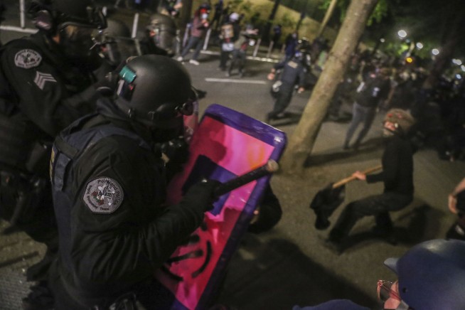 Fires set, fences moved: Police call Portland protest a riot