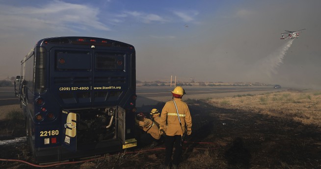 California firefighters continue battling wind-driven wildfire east of San Francisco