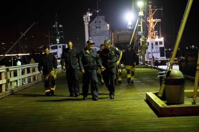 The Latest: Relative: 5 members of same family on boat