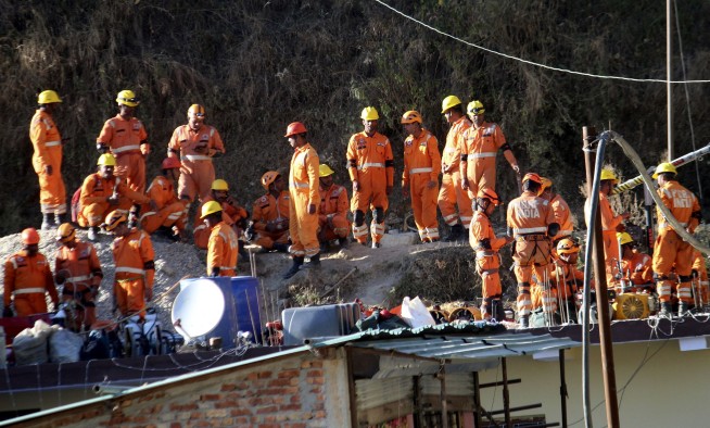 Digging to rescue 41 workers trapped in a collapsed tunnel in India halted after machine breaks