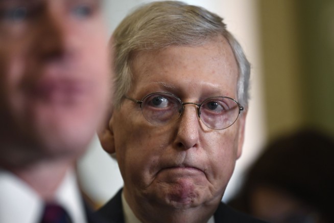 The Latest: McConnell says Trump 'is not a racist'