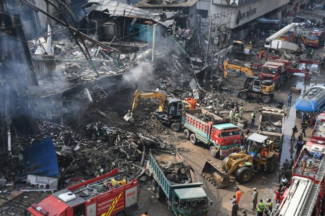 Karachi mall fire death toll rises to 23 as rescuers search for dozens missing