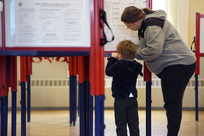 The Latest | Former Trump presidential campaign adviser advances in Texas