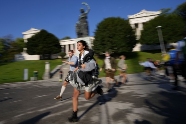 Beer flows and crowds descend on Munich for the official start of Oktoberfest