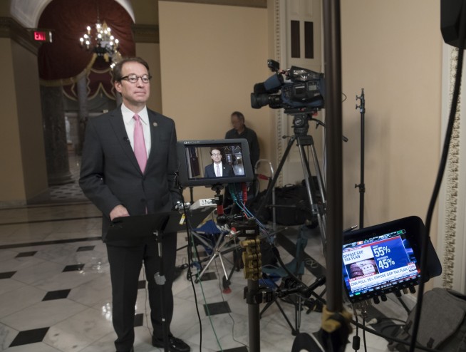 The Latest: House forced to revote on GOP tax bill Wednesday