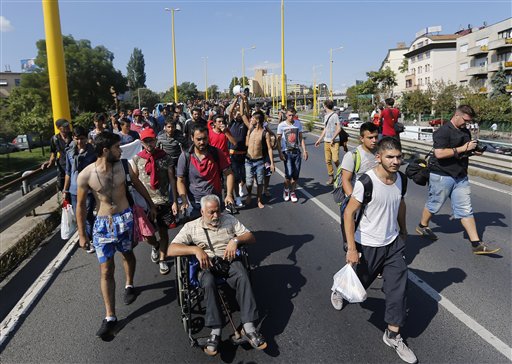 The Latest: EU hopes to redistribute 120,000 migrants