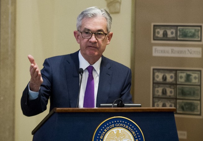 Fed lifts rates for 4th time this year but sees fewer hikes
