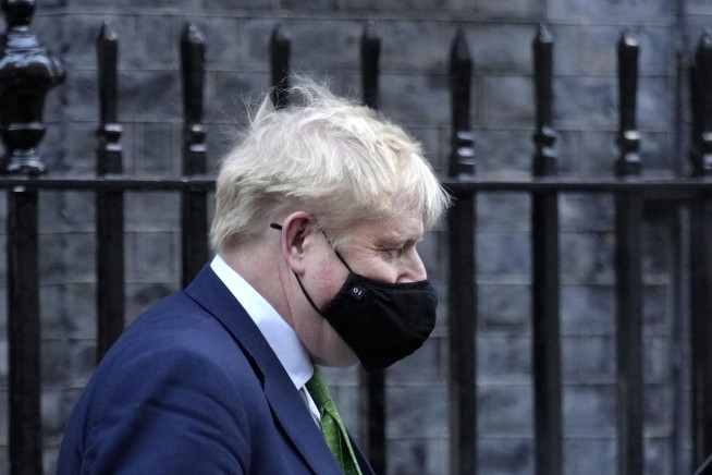 UK's Johnson defies calls to quit as ouster bid gathers pace