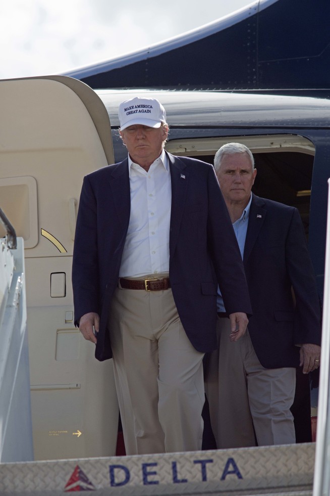 Trump in Louisiana to survey floods as Manafort resigns