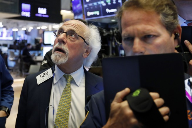 Stocks indexes edge higher to finish off a wobbly week