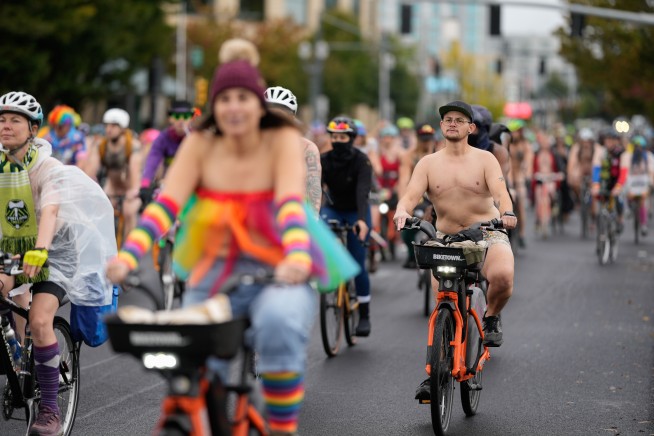 Naked bike riders demonstrate against federal troops in 'quintessentially Portland' protest