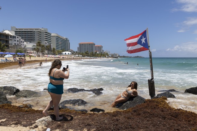 Hurricane Erin weakens to Category 3 as forecasters warn of storm's rapid growth