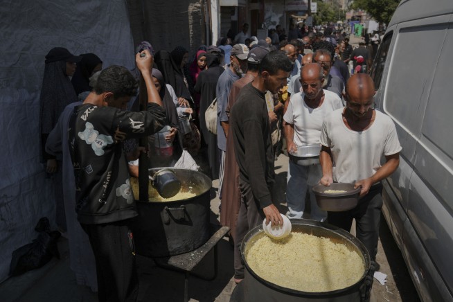 Israel calls on famine-stricken residents to flee and targets more high-rises in Gaza City