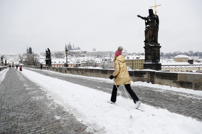 Eiffel Tower needs blowtorch for ice as snow blankets Europe
