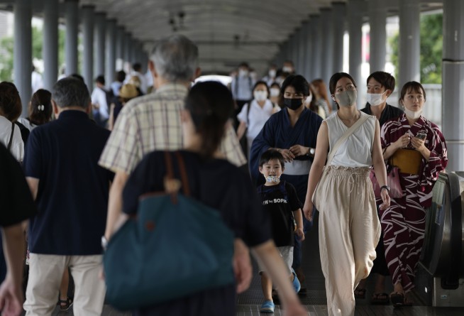 Japan expands virus emergency after record spikes amid Games