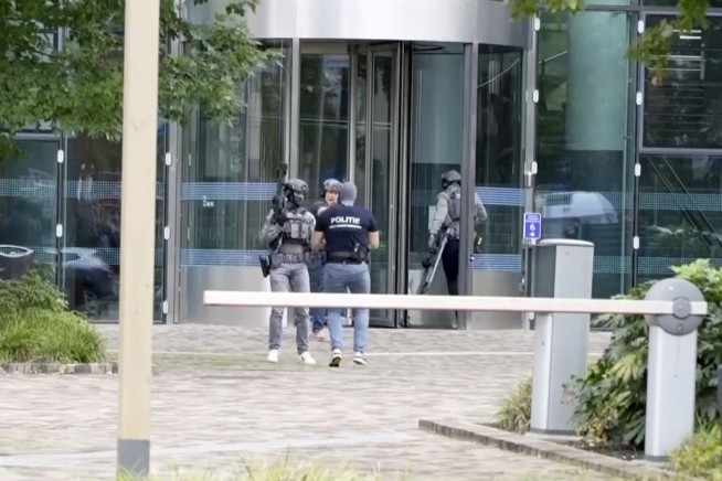Dutch police say 3 people are killed in shootings at a university hospital and home in Rotterdam
