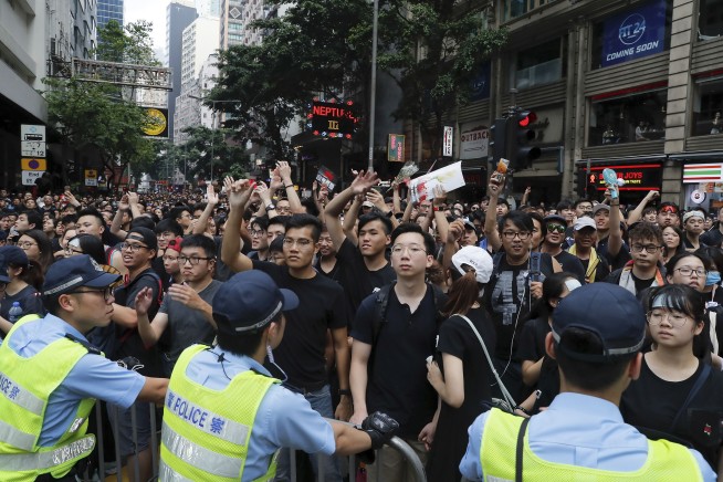Massive protests draw apology from Hong Kong leadership