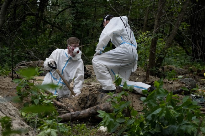 Bucolic Ukraine forest is site of mass grave exhumation