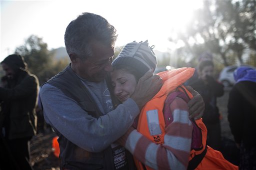The Latest: Merkel: 'Fairer distribution' of refugees needed