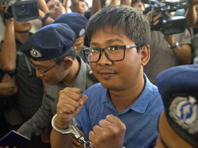 Reuters journalists charged with violating Myanmar law
