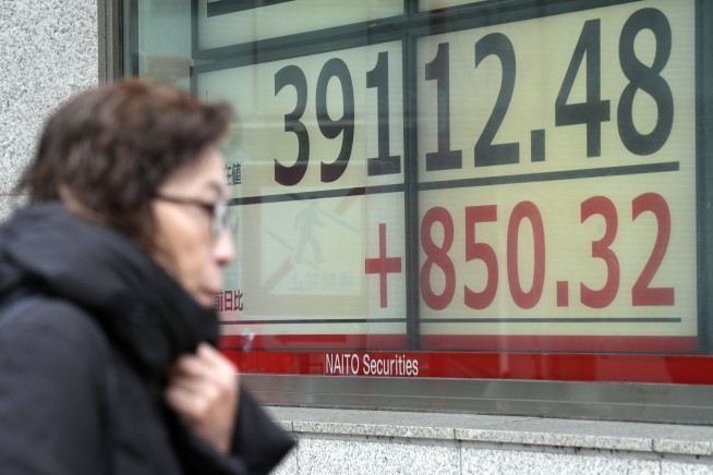 Japan's Nikkei stock index breaks its 1989 record and surges to an all-time high
