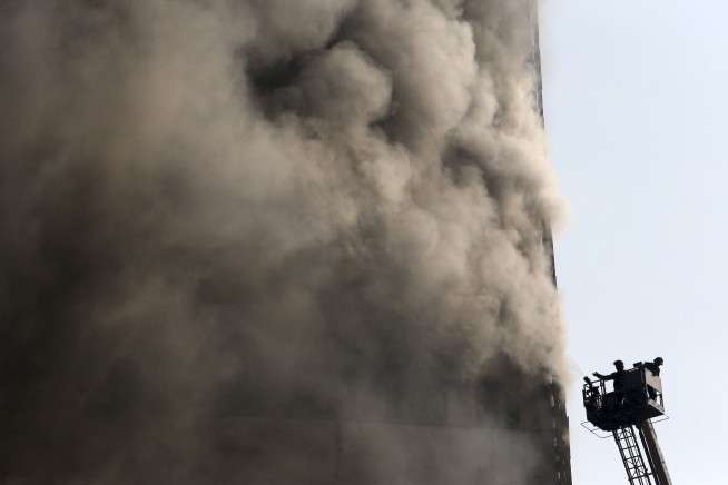 Collapse of Tehran high-rise on fire kills 30 firefighters